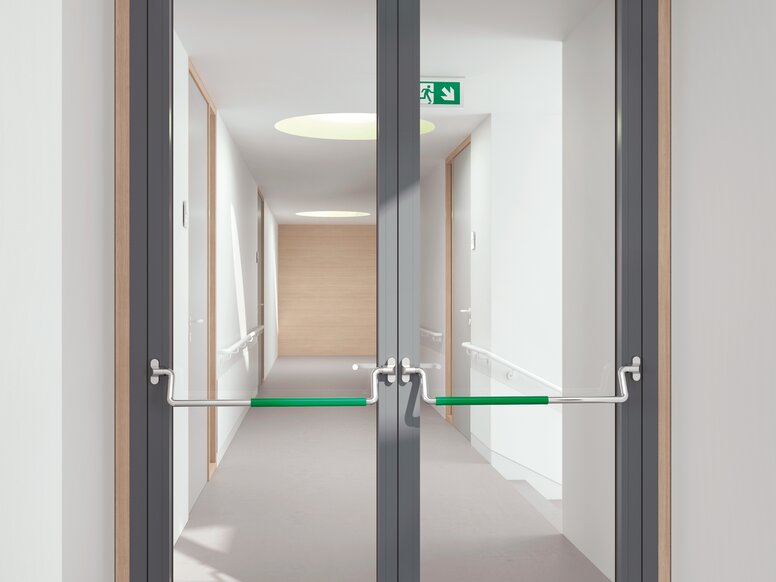 HEWI panic bar stainless steel matt Double glass door equipped with two stainless steel panic bars with green polyamide handle tube
