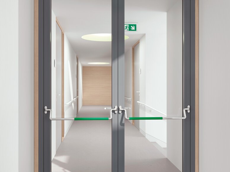 HEWI panic bar stainless steel Double glass door equipped with two stainless steel panic bars with green polyamide handle tube