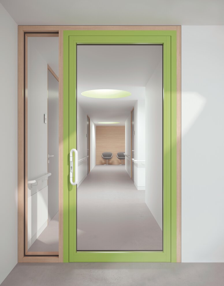 HEWI lever handle signal white Glazed hospital door with green frame equipped with a lever handle in the colour signal white made of polyamide