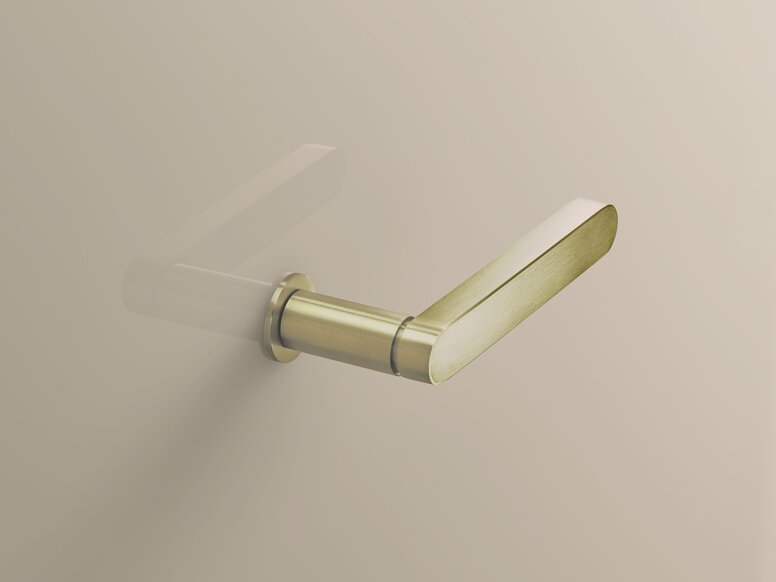 Brass-coloured PVD door handle with a brushed surface, a round rose and an even lever handle on a beige-coloured wall