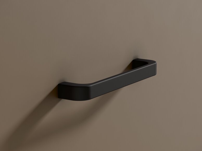 Black powder-coated support rail on a beige wall