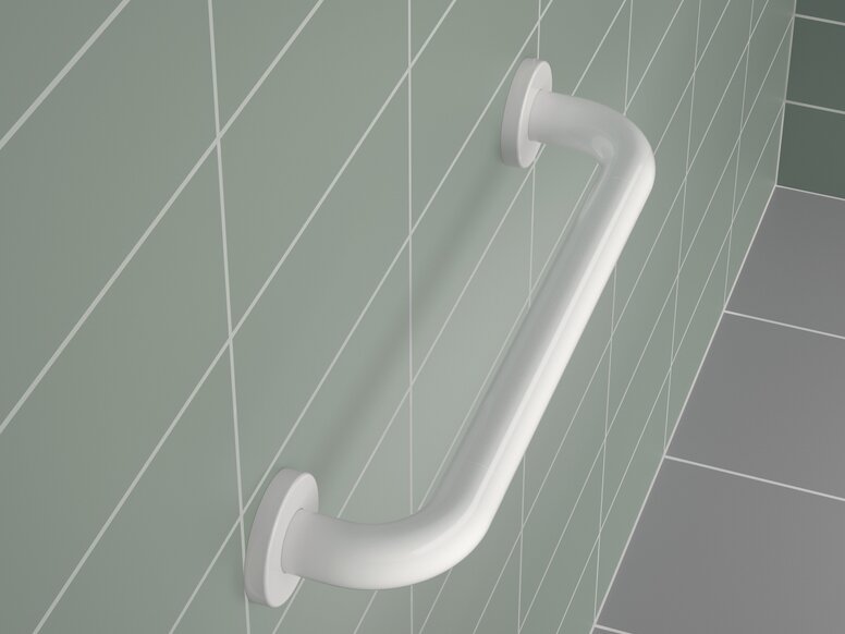 White synthetic material support rail with a round tube and brackets on a green tiled wall