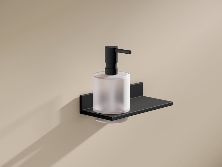 Black powder-coated wall bracket with soap dispenser and flat shelf on a beige-coloured wall
