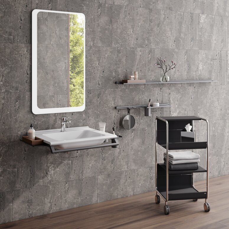 HEWI washbasin and side trolley Modular washbasin with grab rail and shelves, side trolley next to it in the colour black matt